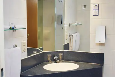 a bathroom with a sink and a mirror at Holiday Inn Express Hasselt by IHG in Hasselt