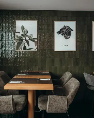 a conference room with a wooden table and chairs at Hotel Ecu in Genk