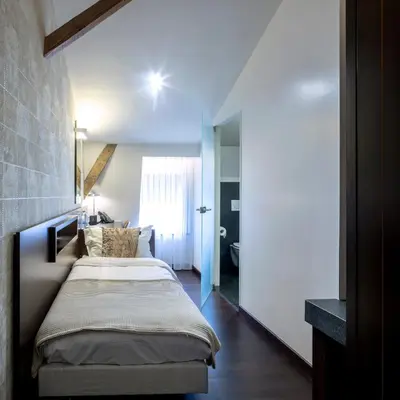 a bedroom with a bed in a room at Hotel The Century in Hasselt