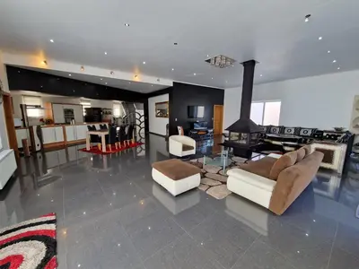 a living room with couches and a fireplace at Sérénité - Espace Détente Ensival in Ensival