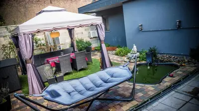 a gazebo with a tub in a backyard at Sérénité - Espace Détente Ensival in Ensival
