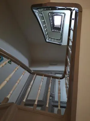 a stairwell with a mirror on the ceiling at Hôtel Les Acteurs in Liège