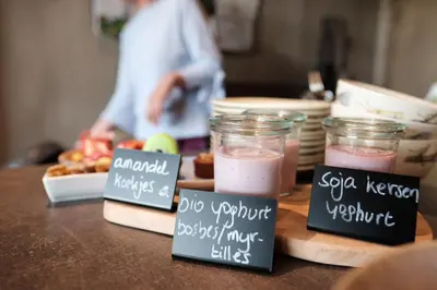 a counter with some signs on a table with food at Relax B&B Lavendine Pure in Genk