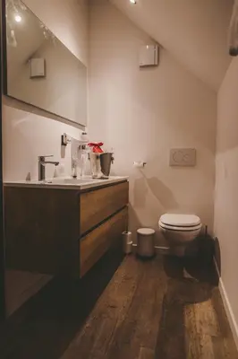 a bathroom with a sink and a toilet at Hôtel Hors-Château - Liège Centre Historique in Liège