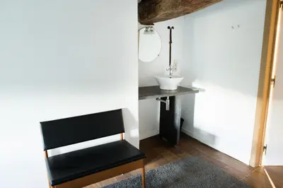 a bathroom with a sink and a mirror at Maison Sainte-Marguerite in Liège