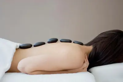 a woman laying on a bed with her head on a pillow at Carbon Hotel in Genk
