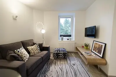 a living room with a couch and a coffee table at Xperience-Today Eupen in Eupen
