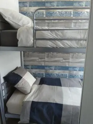 a bunk room with a bed and a pillow at B&B Hoeven Het Gehucht in Overpelt