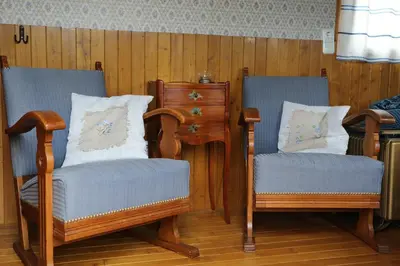 two chairs sitting next to each other in a room at B&B Dream On Wheels in Lommel
