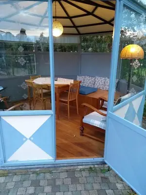 a room with a table and a dining room at B&B Dream On Wheels in Lommel