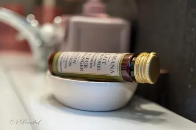 a bottle of oil sitting on top of a bowl at 't Poorthof in Borgloon