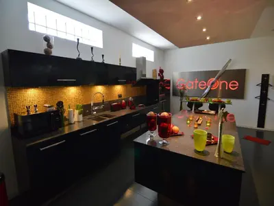 a kitchen with a counter with drinks on it at Holiday Home in Welkenraedt with Sauna in Welkenraedt
