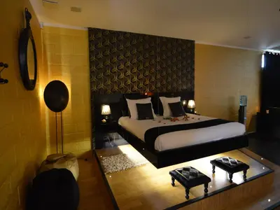 a bedroom with a large bed in a room at Holiday Home in Welkenraedt with Sauna in Welkenraedt