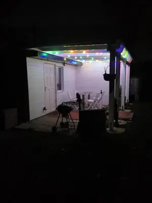 a garage lit up at night with lights on it at Ferienhaus Congolo in Lontzen