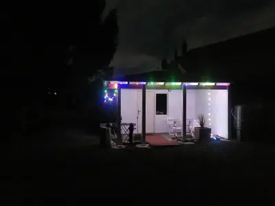 a small house with lights on it at night at Ferienhaus Congolo in Lontzen