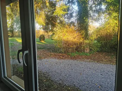 a view of a yard from a window at Ferienhaus Congolo in Lontzen