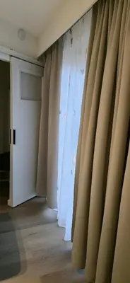 a curtain in a room with a door at Den 1 Hengelhoef in Houthalen-Helchteren
