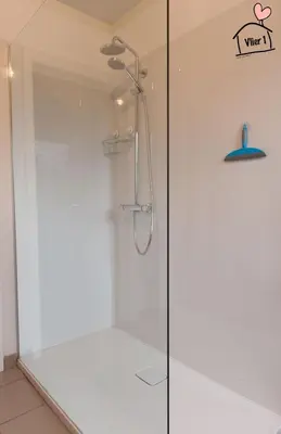 a shower with a glass door in a bathroom at De Vlier - Vakantiewoningen in Maasmechelen