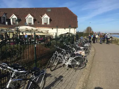 a bunch of bikes parked next to a fence at Hotel De Spaenjerd in Kinrooi