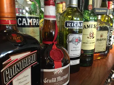 a group of bottles of alcohol sitting on a table at Hotel De Spaenjerd in Kinrooi