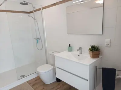 a bathroom with a white sink and a shower at InContri in Liège