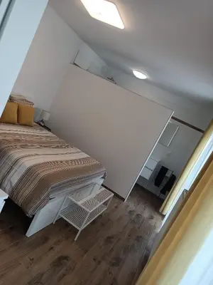 a small room with a bed and a table at InContri in Liège