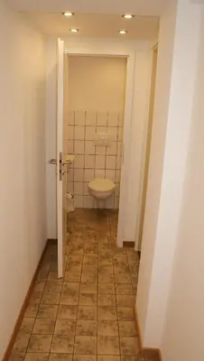 a bathroom with a toilet and a sink at Übernachten im ehemaligen Zollgebäude in Hauset