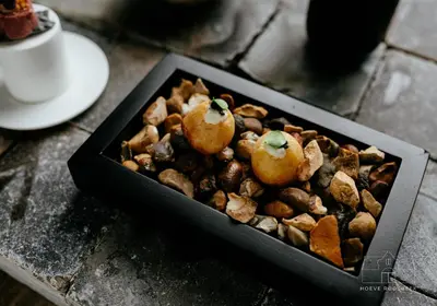 a black box of food on a table at Hoeve Roosbeek in Zepperen