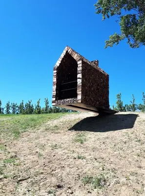 a building sitting on top of a hill at De Verborgen Parel B&B in Borgloon