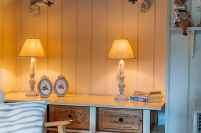 two lamps on a table in a room at Chalet Luxe in Zutendaal
