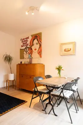 a dining room with a table and chairs at Lyves in Liège