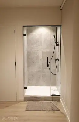 a shower in a bathroom with a glass wall at PRET A GOUTER bistro bar bed in Heusden - Zolder