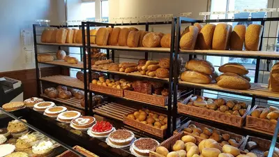 a bakery filled with lots of different types of pastries at B&B Huize Briers in Bilzen