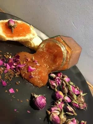 a donut with peanut butter and flowers on a plate at De Ruttermolen in Tongeren