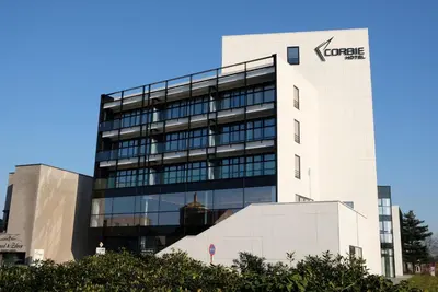 a building with a sign on the side of it at Corbie Lommel Ring in Lommel