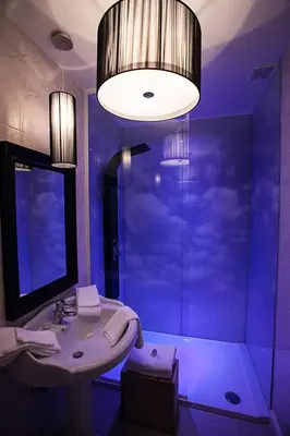 a purple bathroom with a sink and a shower at Villa Valentino in Hasselt