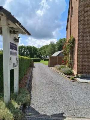 a driveway outside of a brick building at Vakantiewoning Tivoli in Dilsen-Stokkem