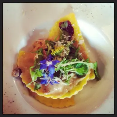 a white plate with a dish of food with broccoli at B&B Domaine Villa Bayard in Kanne