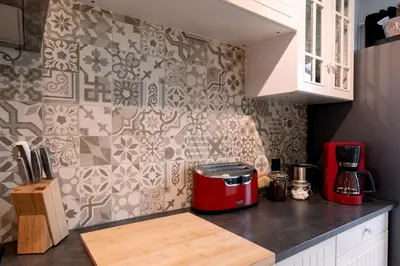 a kitchen with a red appliance on a counter at De Villo in Hasselt
