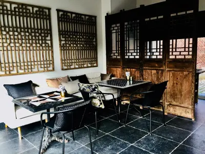 a dining room with a table and chairs at Kirisavan Bed&Breakfast in Borgloon