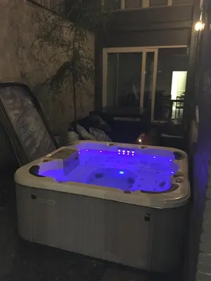 a jacuzzi tub with blue lights in a room at Hollandia City Distillery in Hasselt