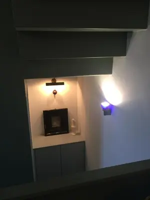 a small room with a light on the wall at fermette in Lontzen