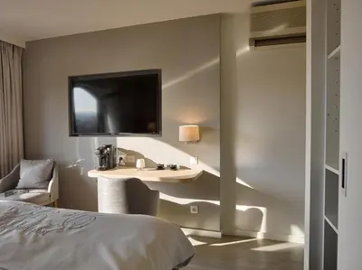 a hotel room with a sink and a bed at Hotel Restaurant De Kommel in Voeren