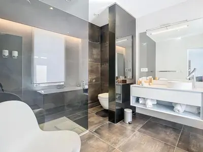 a bathroom with a sink and a toilet and a mirror at Les Begards Espace 9 in Chaudfontaine