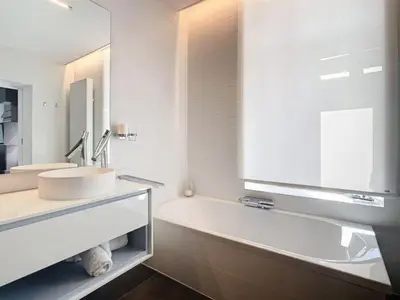 a bathroom with a sink and a large mirror at Les Begards Espace 9 in Chaudfontaine