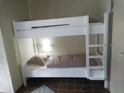 a white bunk bed in a room at Hengelhoef vakantieverblijf DEN 5 in Houthalen-Helchteren