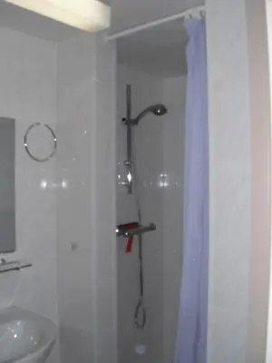 a bathroom with a shower and a sink at Hengelhoef vakantieverblijf DEN 5 in Houthalen-Helchteren