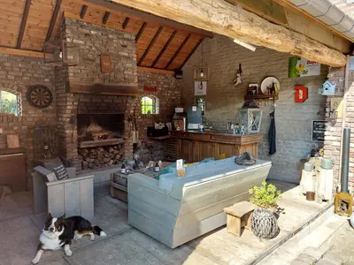 a kitchen with a dog sitting in front of a kitchen at Widdingenhof in Wellen