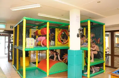 a room with a play structure with children in it at Vakantiepark Wilhelm Tell Vakantieappartement in Oudsbergen