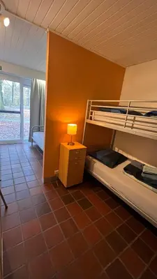 a room with two bunk beds and a lamp at Ceder 9 Hengelhoef in Houthalen-Helchteren